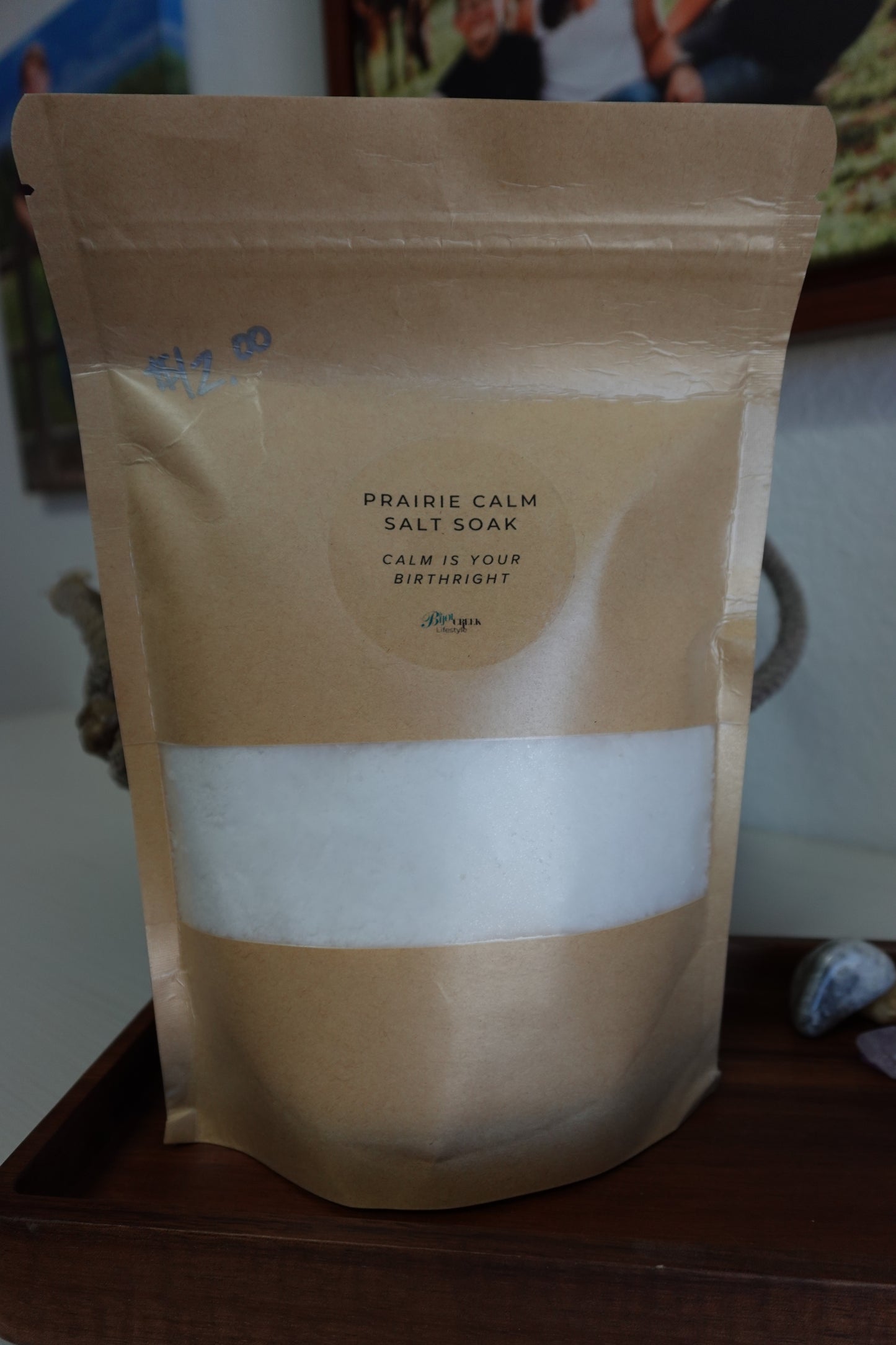 Package of Prairie Calm Salt Soak on a wooden tray