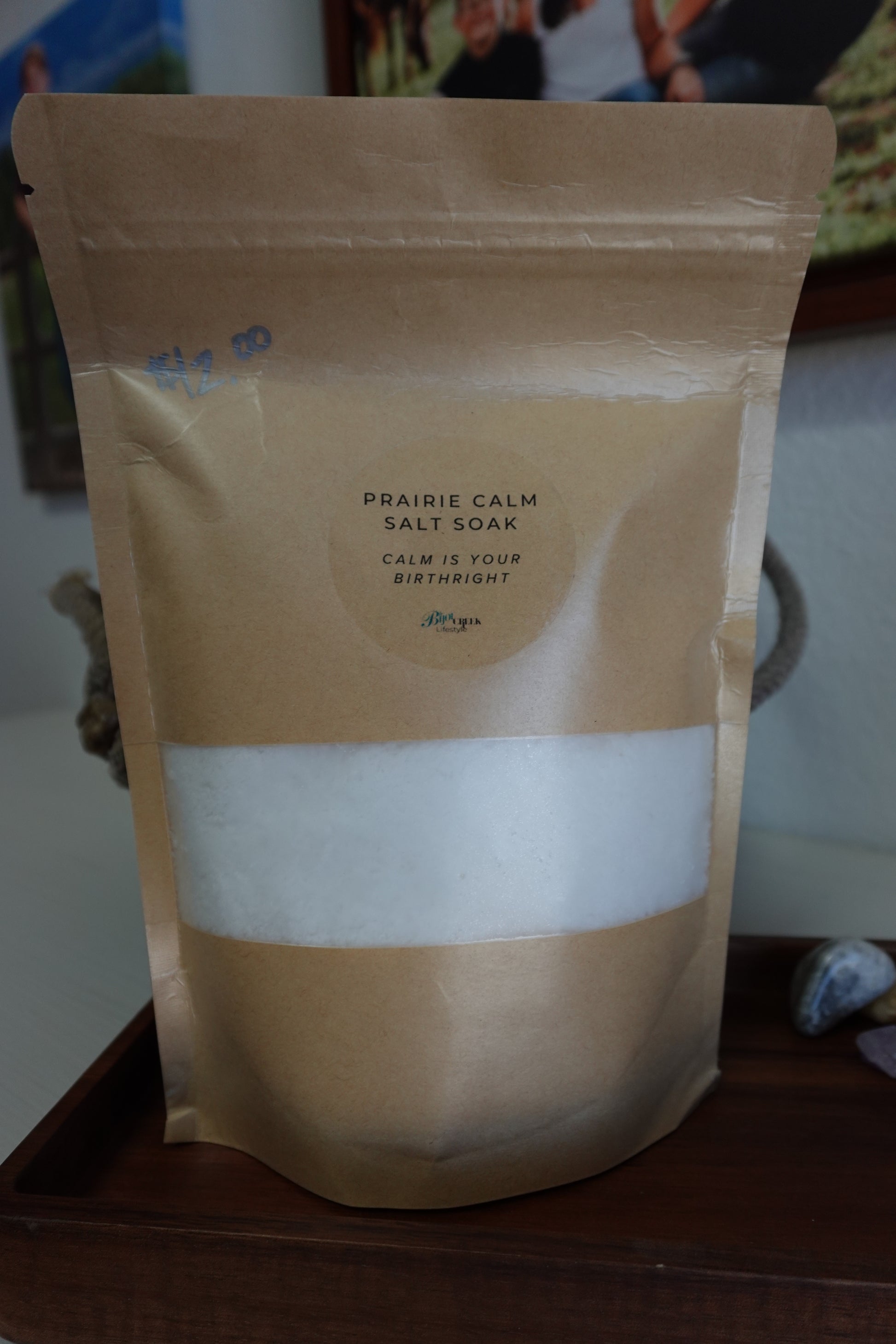 Package of Prairie Calm Salt Soak on a wooden tray