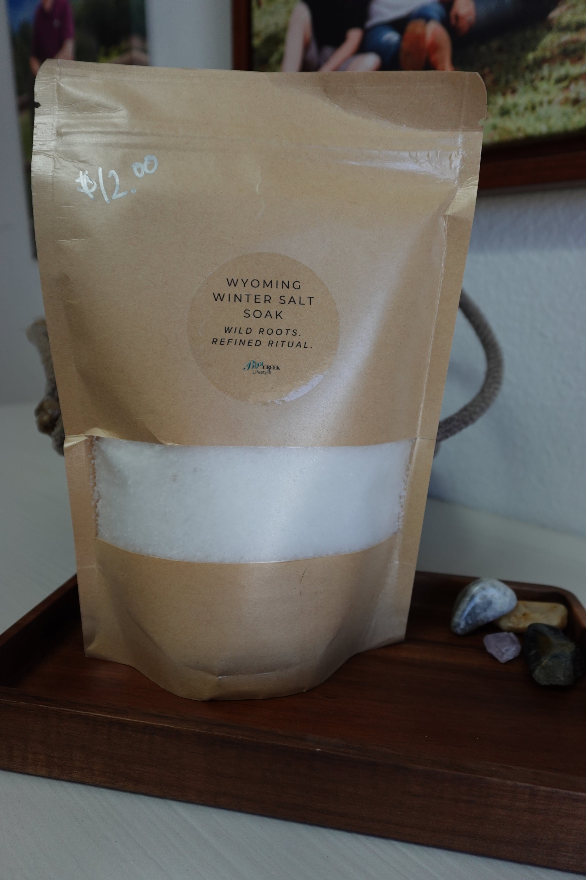 Brown paper bag with a label on a wooden surface