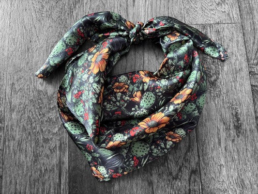 Floral patterned scarf on a wooden surface