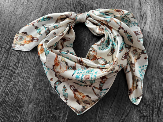 Decorative scarf with animal print on a wooden surface